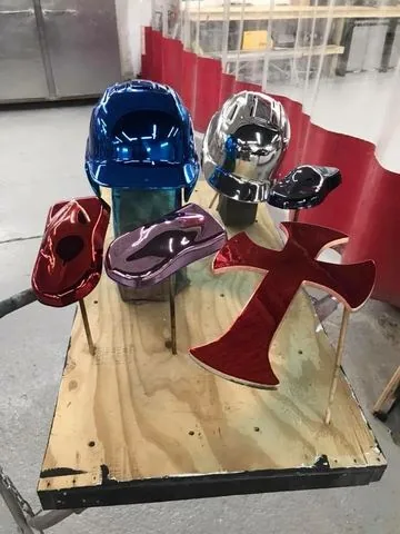 Helmets and a cross finished in candy chrome