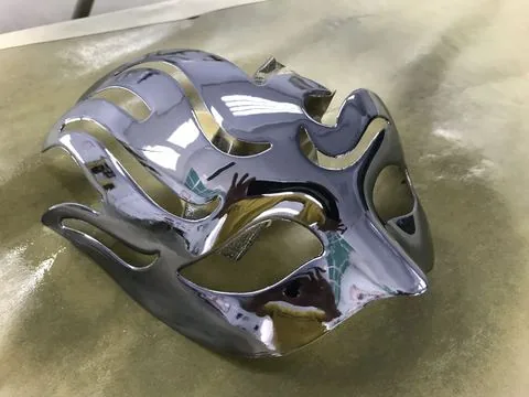 A flamed mask finished in chrome
