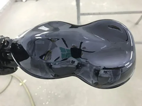 A smoked chrome finish on a shaped panel