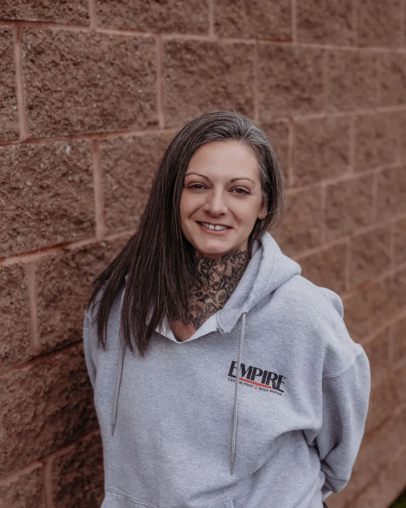Brittany Fox, office assistant, in an Empire sweatshirt