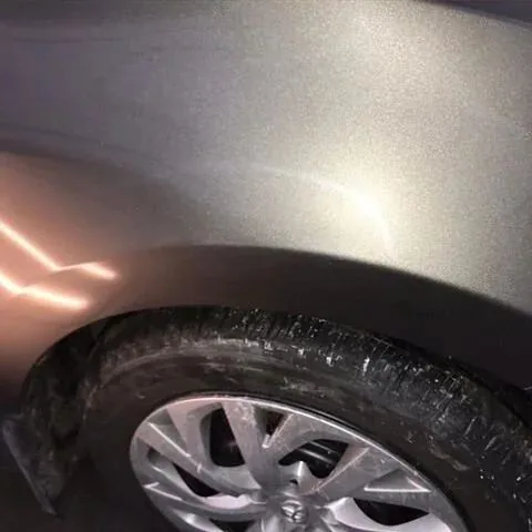 A dent above a fender lip