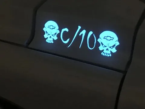A C/10 badge glowing on a truck bed side