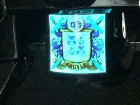 The same crest lit up in Lumilor