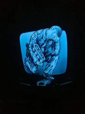 An eagle design glowing on a motorcycle panel