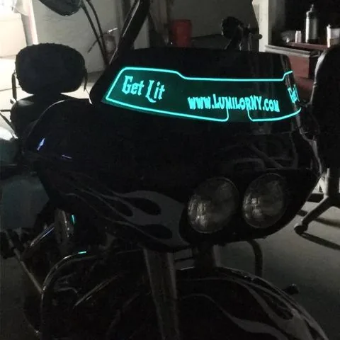 The shop's own bagger with lit lettering along the fairing