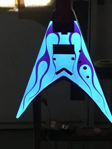 A guitar body finished in Lumilor
