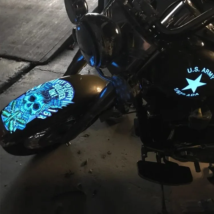 An airbrushed skull on a motorcycle fender, painted by Empire