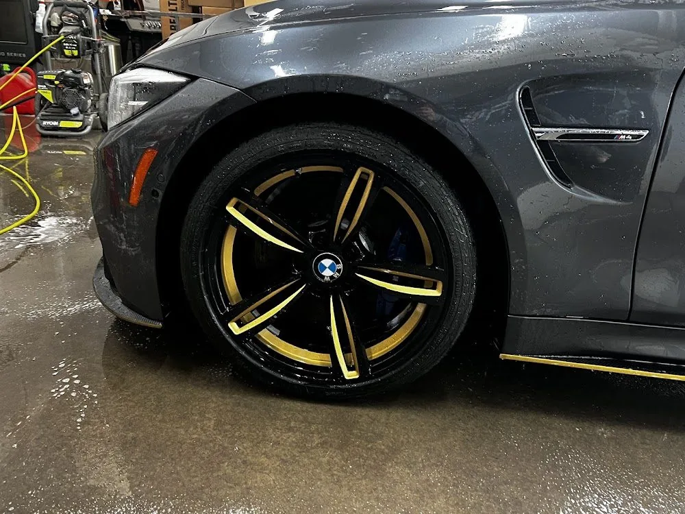 A refinished alloy wheel on a car, with a custom colored face